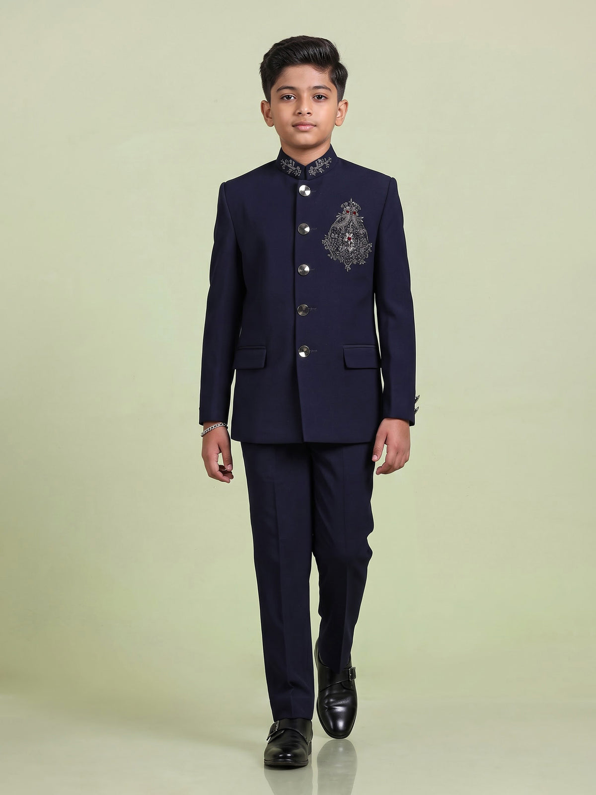 Navy boys jodhpuri suit with embellished crest motif for celebrations