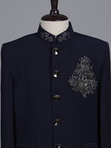 Navy boys jodhpuri suit with embellished crest motif for celebrations