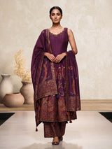 Purple silk anarkali suit with zardosi and pearl embellished details