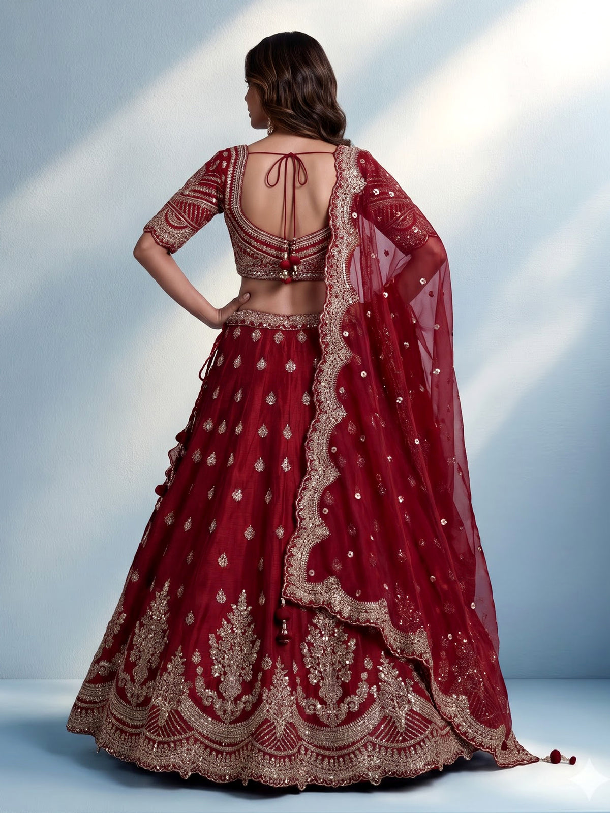Maroon silk bridal lehenga choli with elegant zardosi embellishments