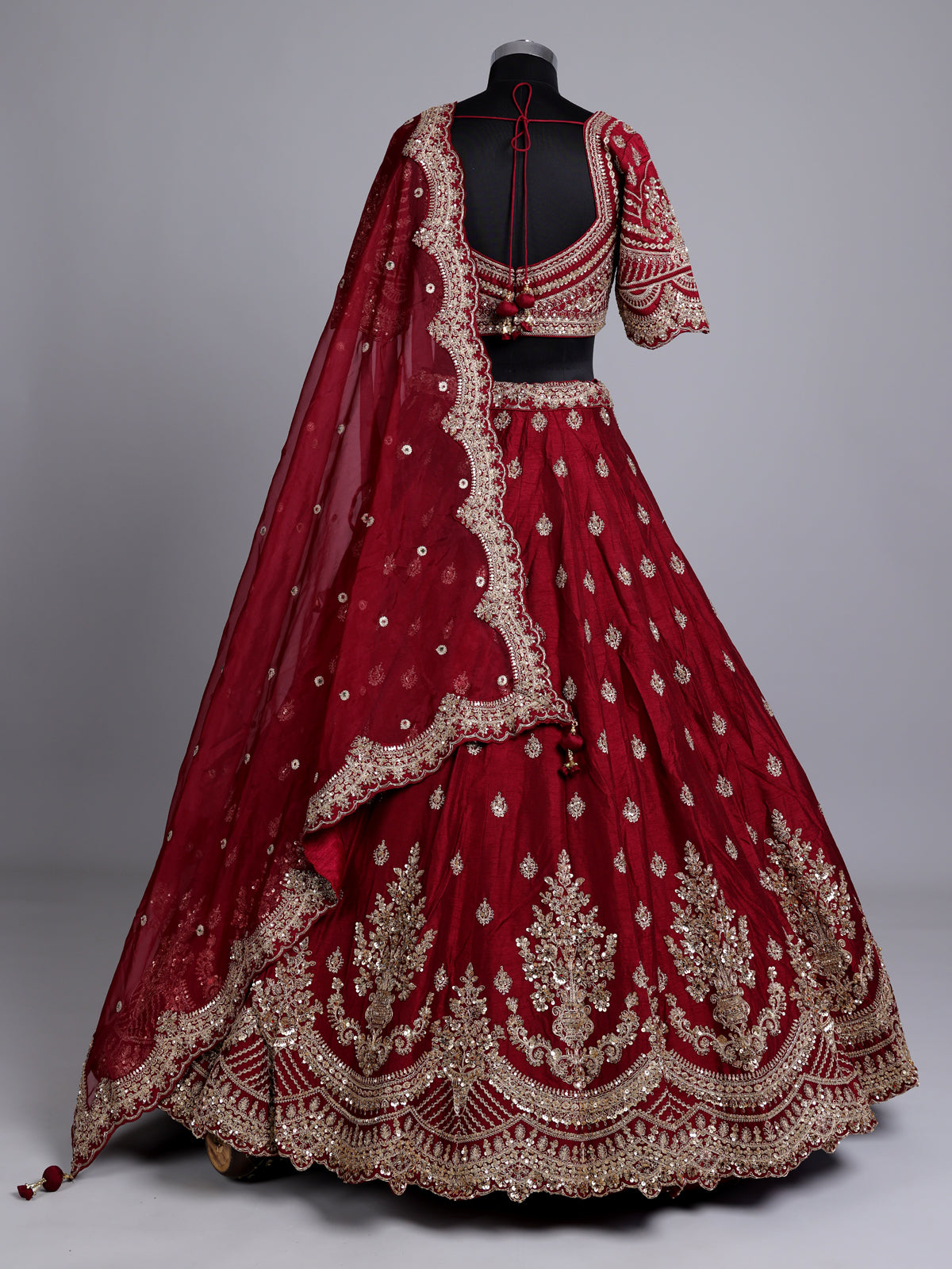 Maroon silk bridal lehenga choli with elegant zardosi embellishments