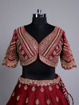 Maroon silk bridal lehenga choli with elegant zardosi embellishments