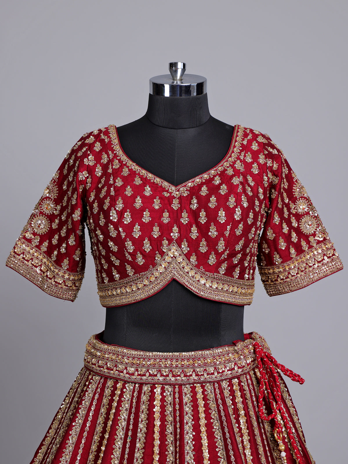 Maroon raw silk bridal lehenga choli with zardosi detailing
