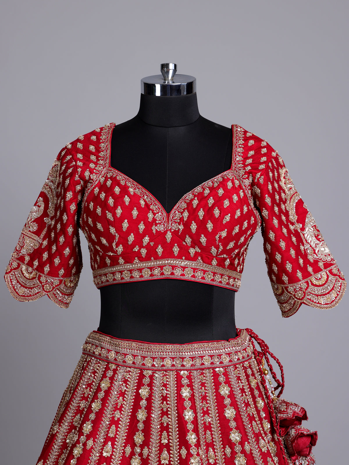 Red silk bridal lehenga choli with exquisite zardosi embellishments