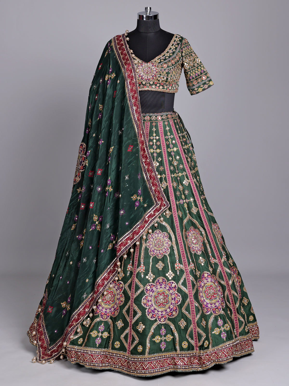 Green raw silk wedding wear lehenga choli with rich work