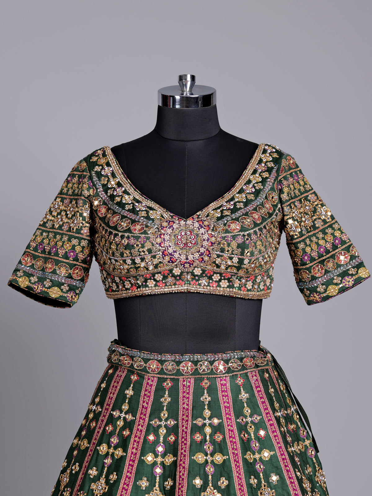 Green raw silk wedding wear lehenga choli with rich work