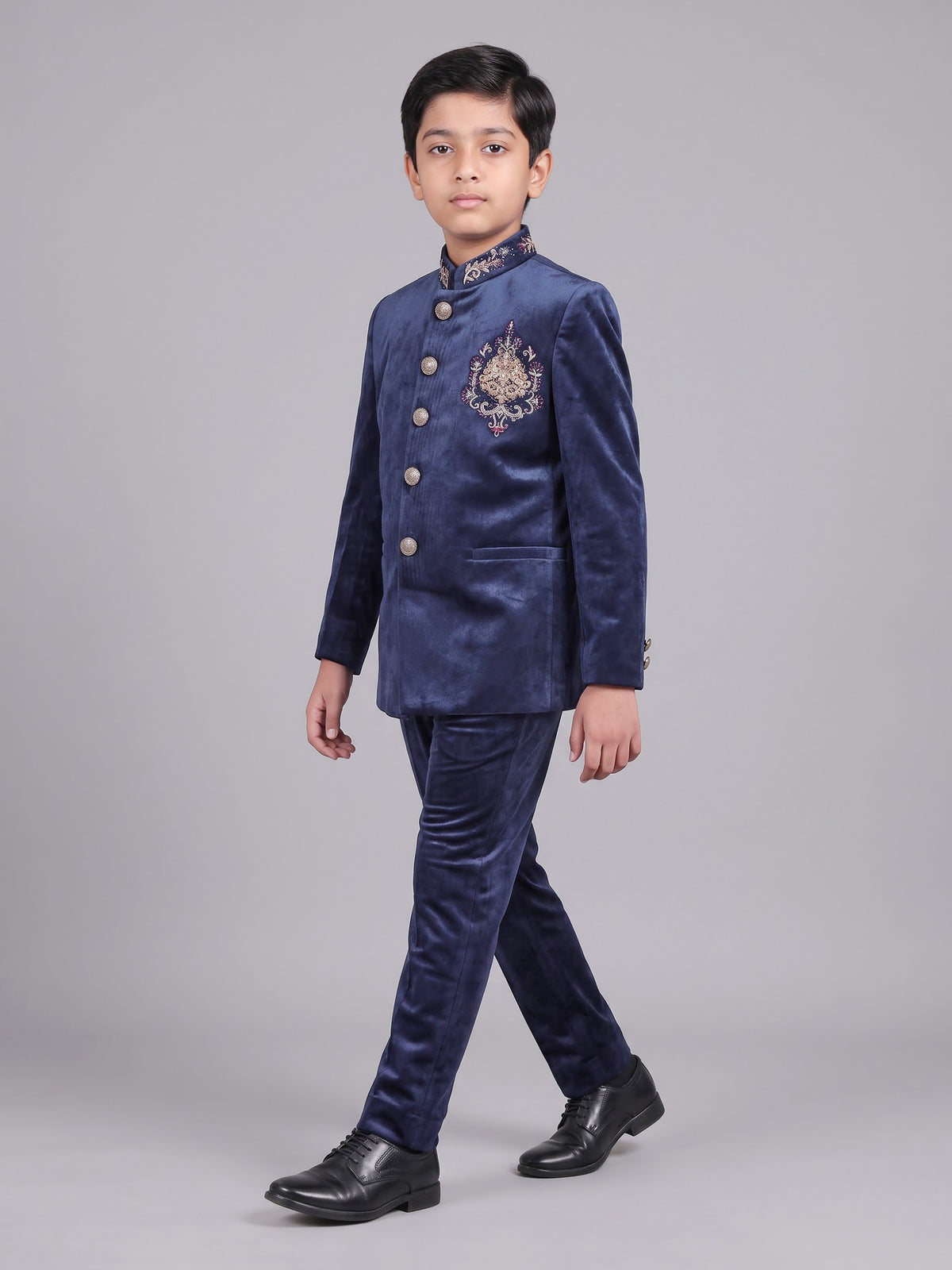 Navy velvet boys Jodhpuri suit with ornate crest detailing