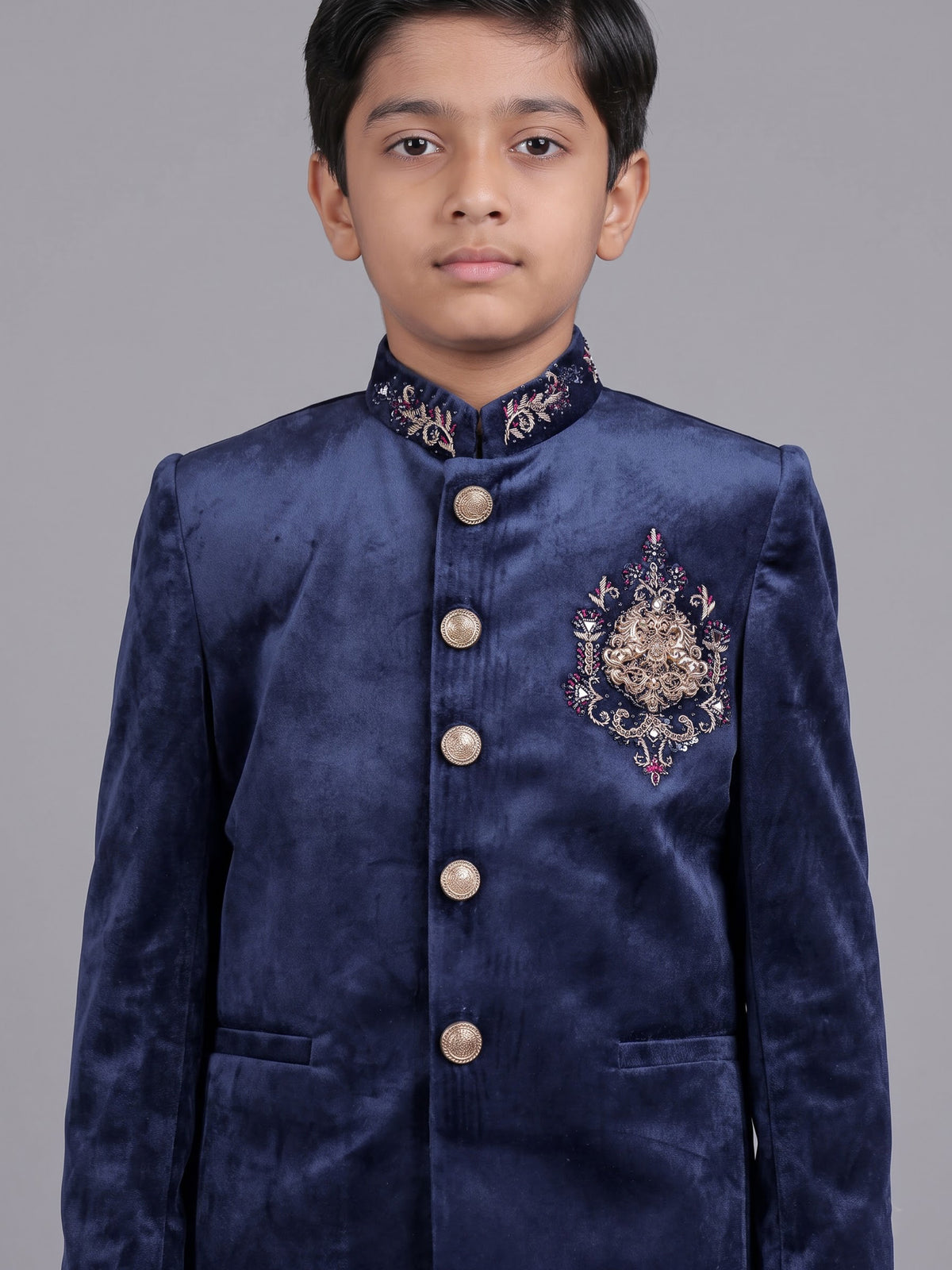 Navy velvet boys Jodhpuri suit with ornate crest detailing
