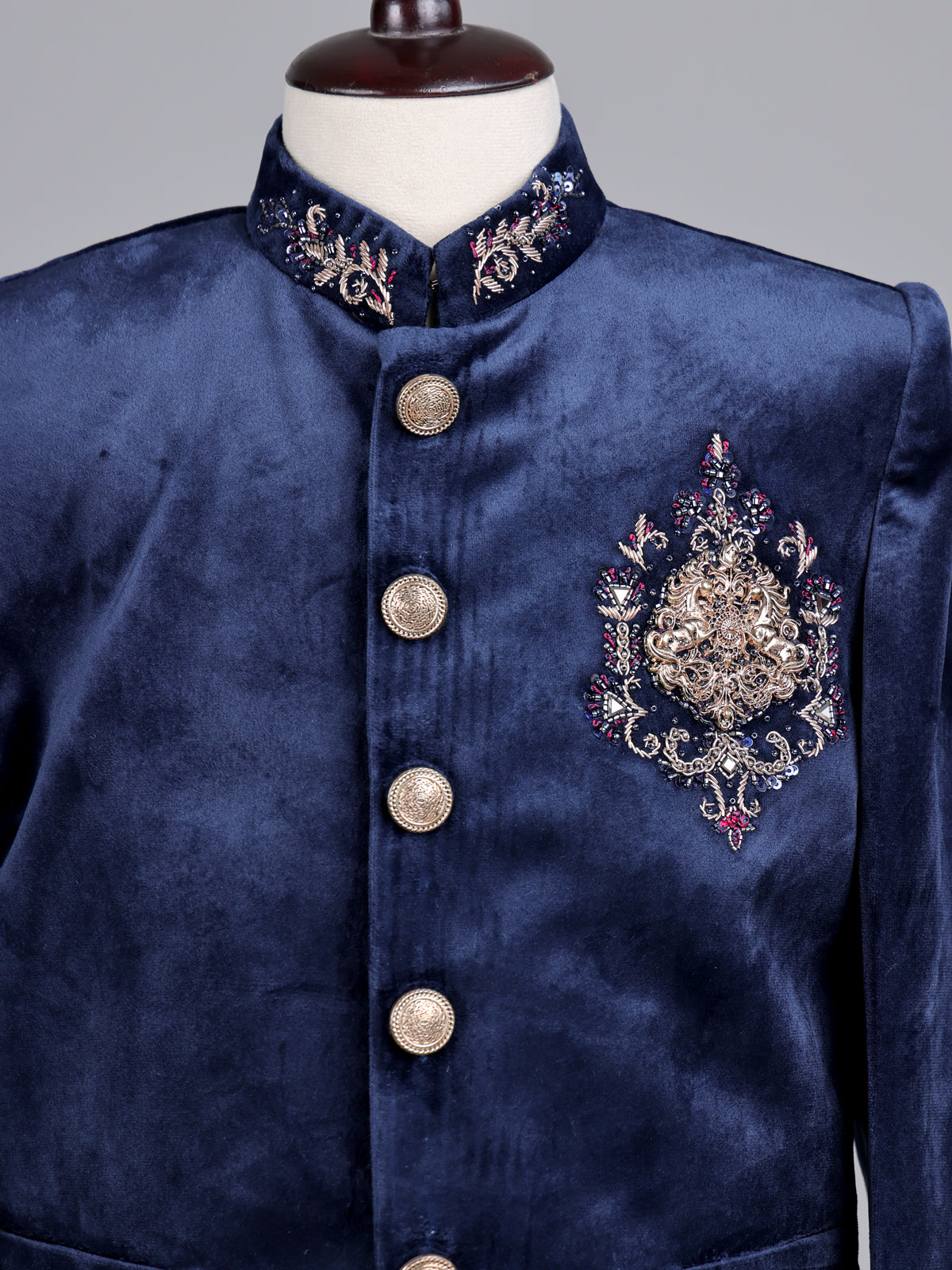 Navy velvet boys Jodhpuri suit with ornate crest detailing