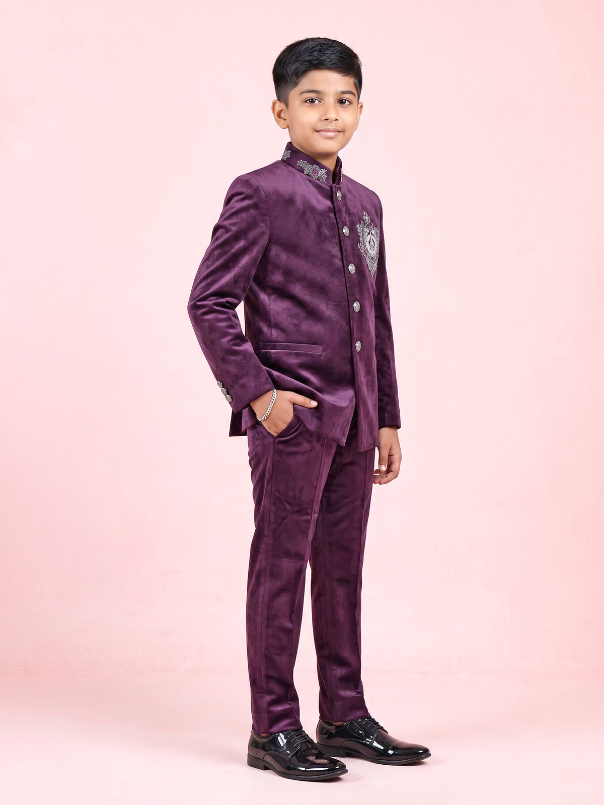 Wine velvet boys Jodhpuri suit with handcrafted crest motif