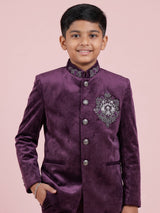 Wine velvet boys Jodhpuri suit with handcrafted crest motif