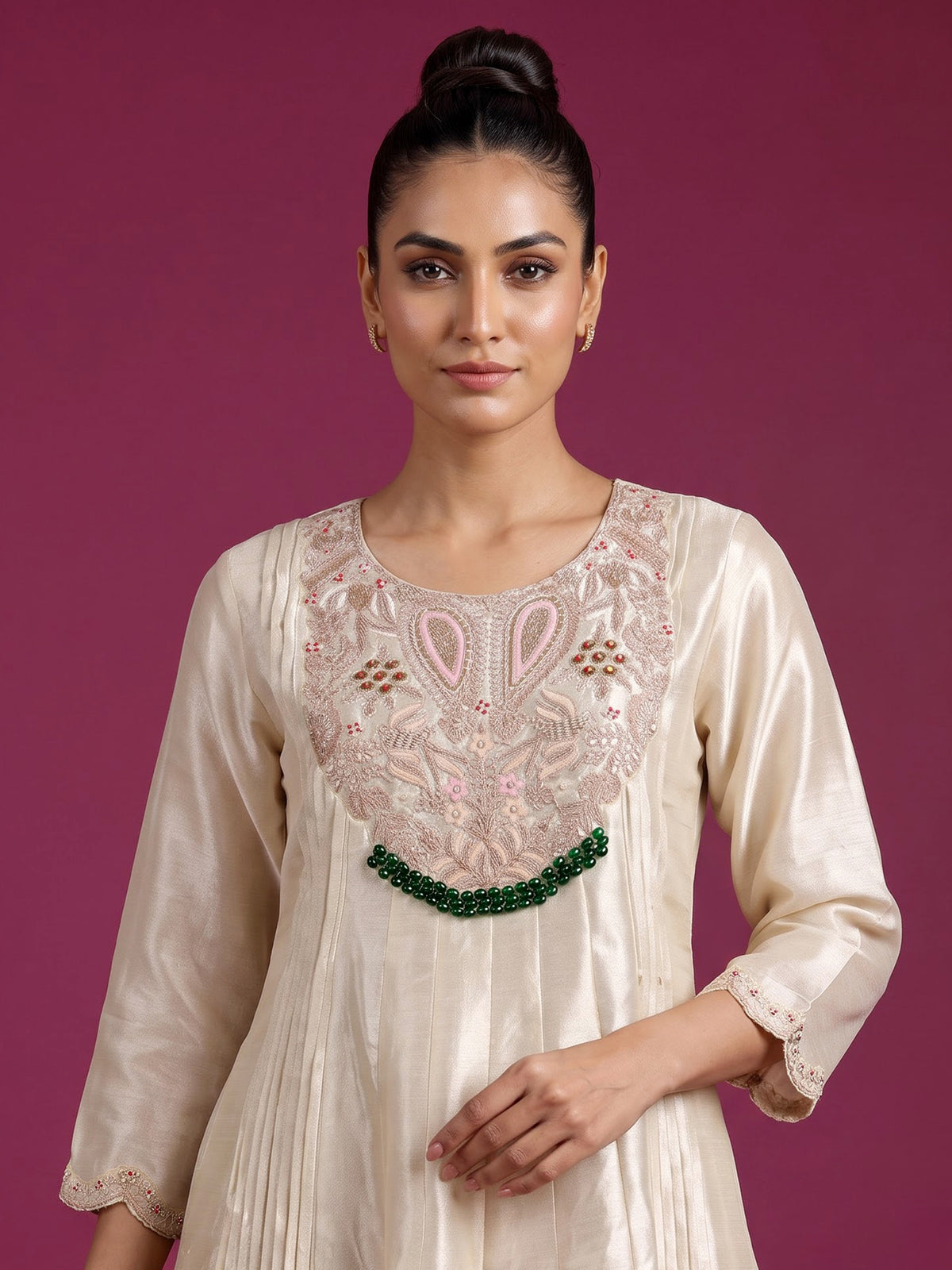 Cream silk anarkali suit with dupatta and ornate embellishments
