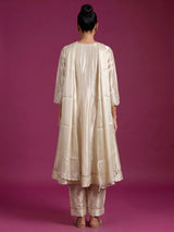Cream silk anarkali suit with dupatta and ornate embellishments