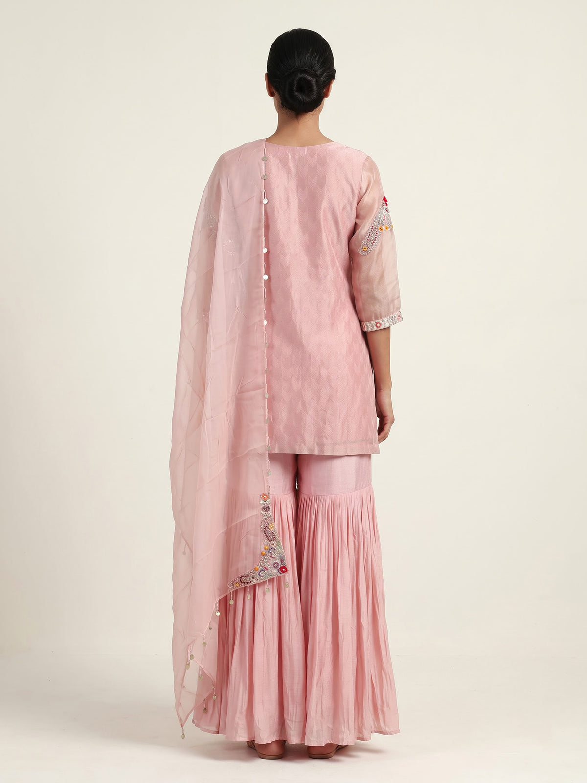 Light peach silk designer sharara suit with ornate embellishments