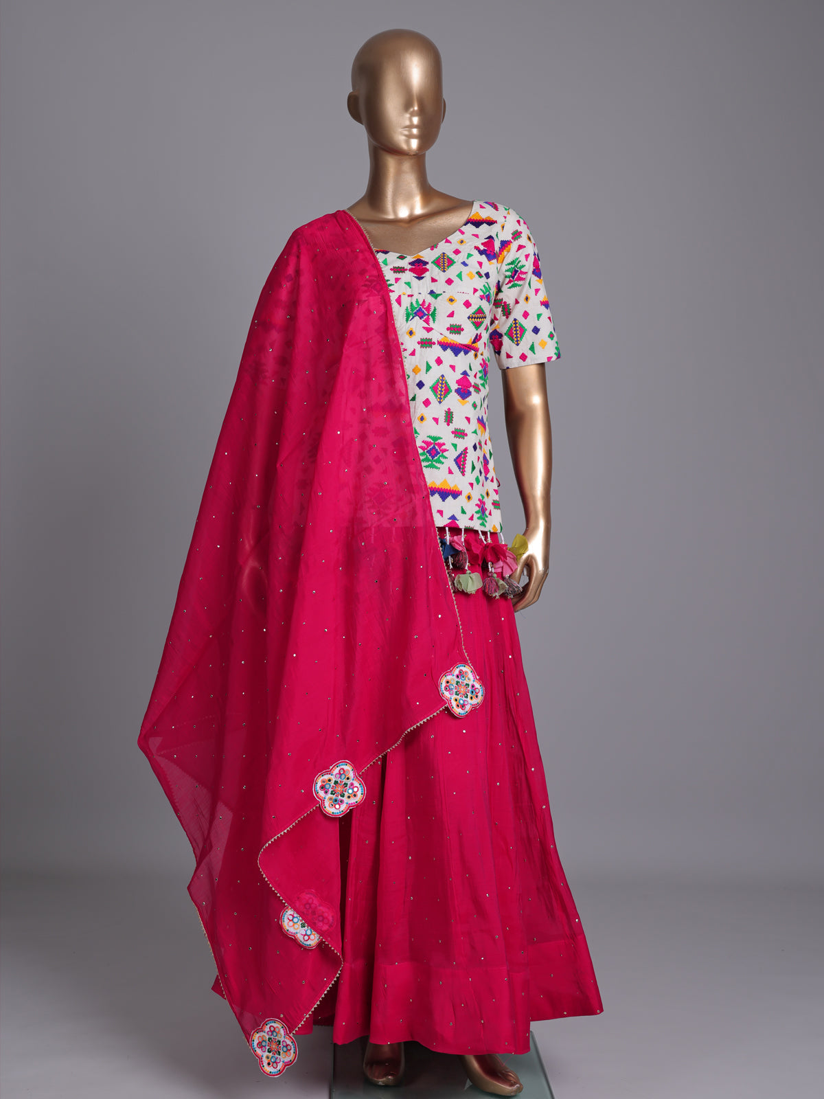 Red soft silk Navratri lehenga choli with charming stone accents