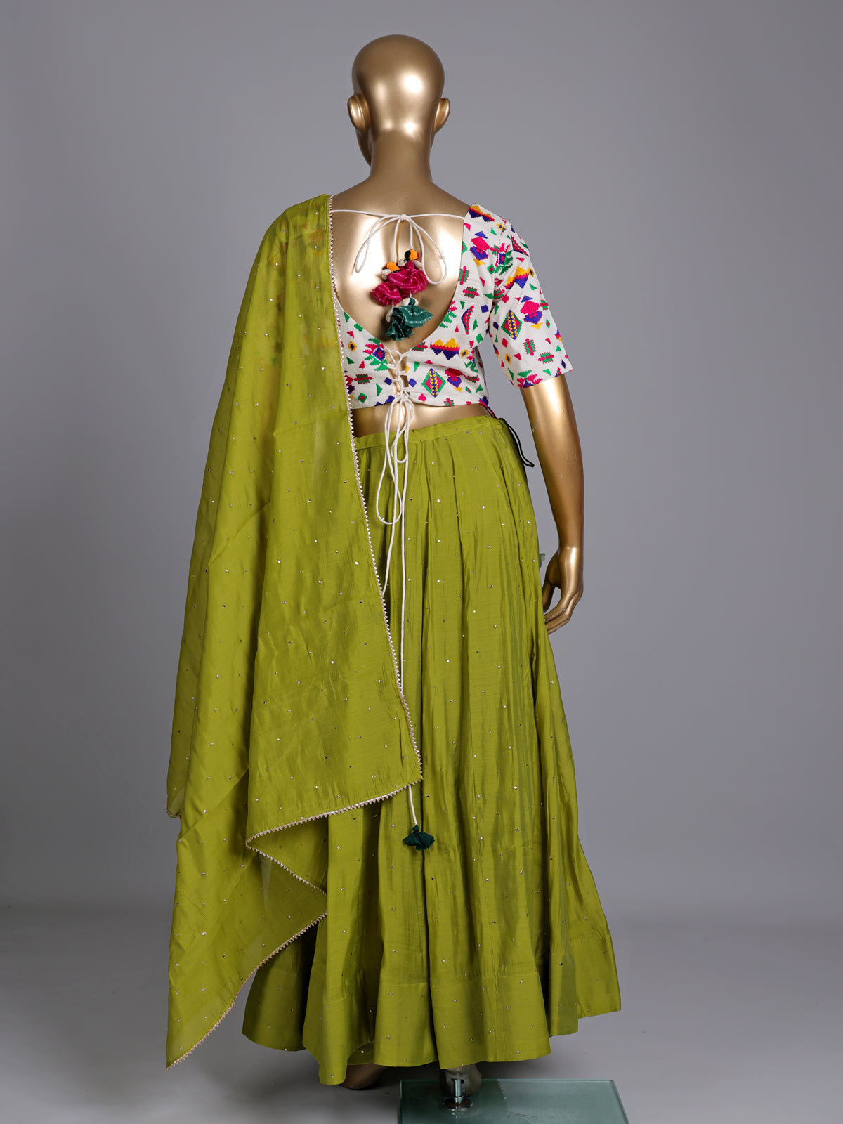 Green soft silk Navratri lehenga choli with delicate stone detailing