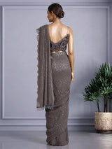 Brown designer net saree with zardosi embellished blouse detailing