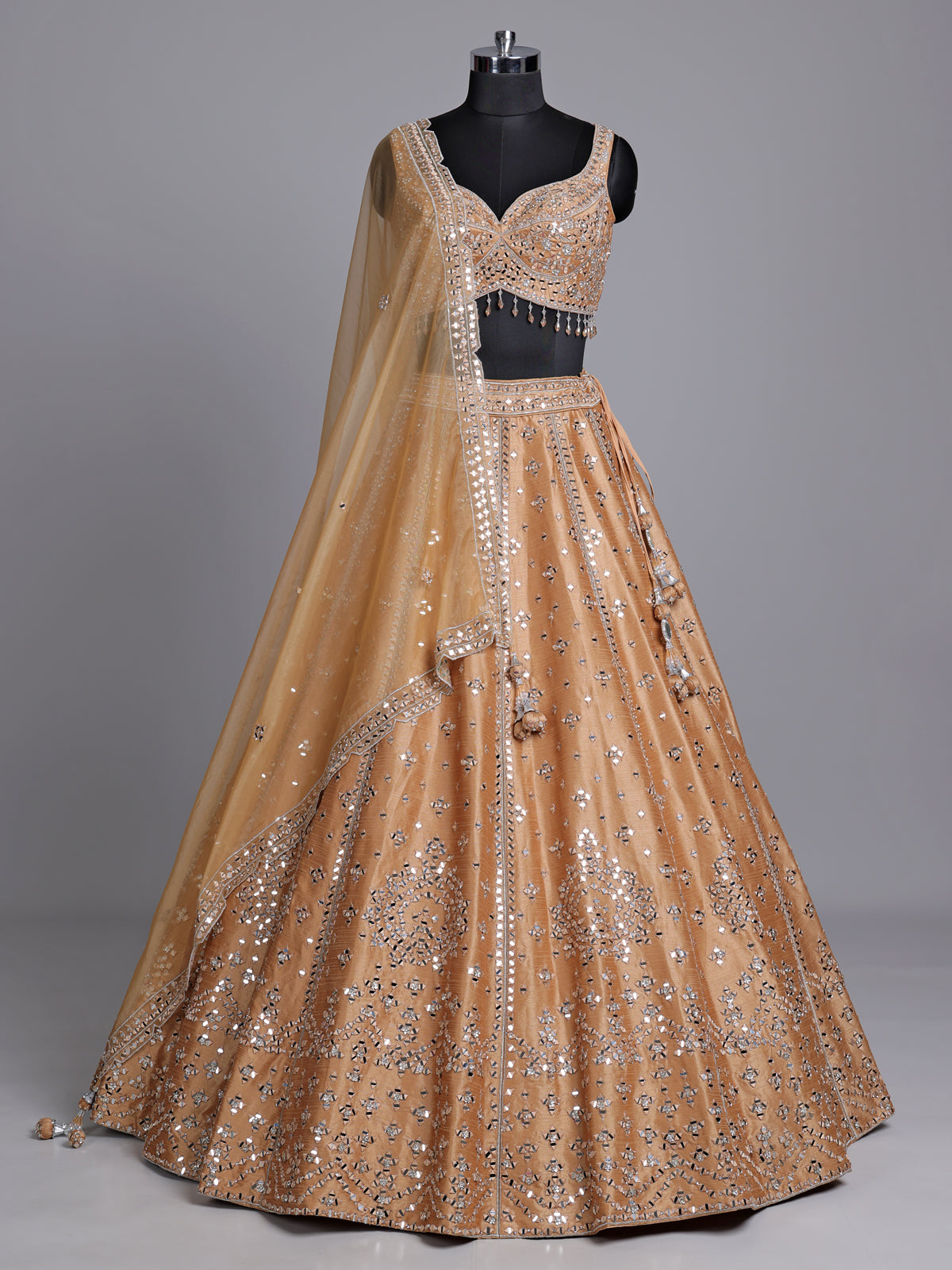 Peach raw silk lehenga choli with elegant diamond and aabla work