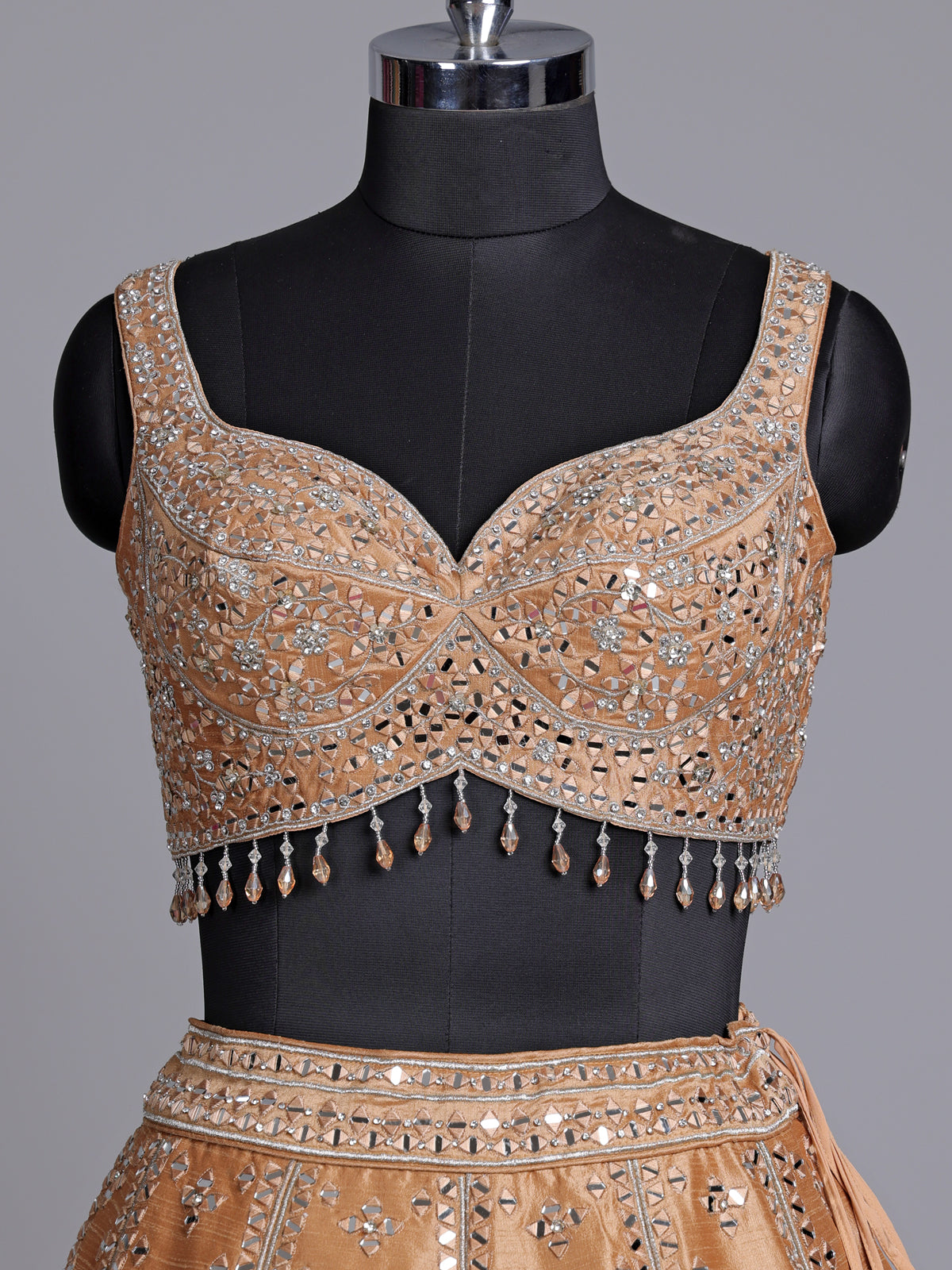 Peach raw silk lehenga choli with elegant diamond and aabla work