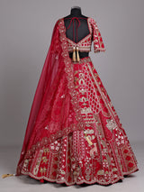 Maroon raw silk lehenga choli with artistic motifs and tassels
