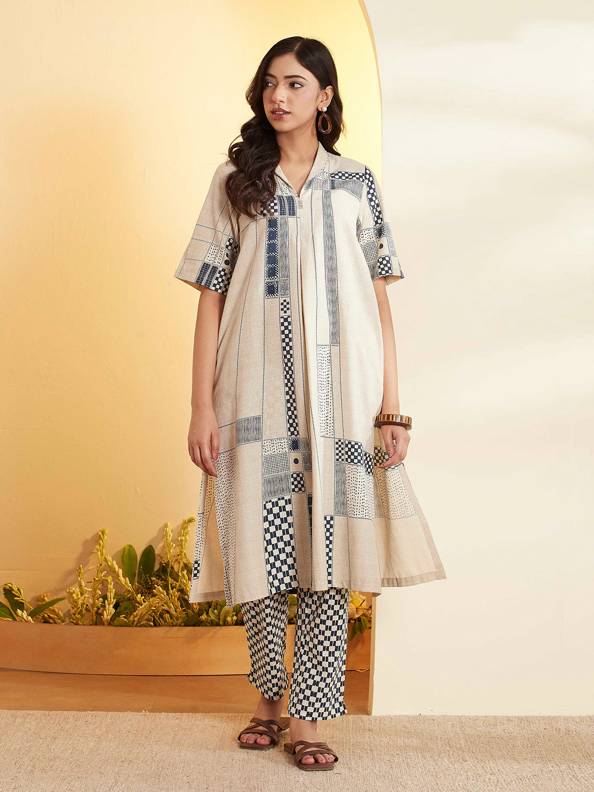 Beige a-line kurti set with printed detail
