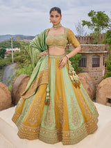 Mint green and gold silk lehenga choli with zig zag texture
