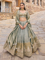 Grey silk lehenga choli with peacock motifs and shaded dupatta