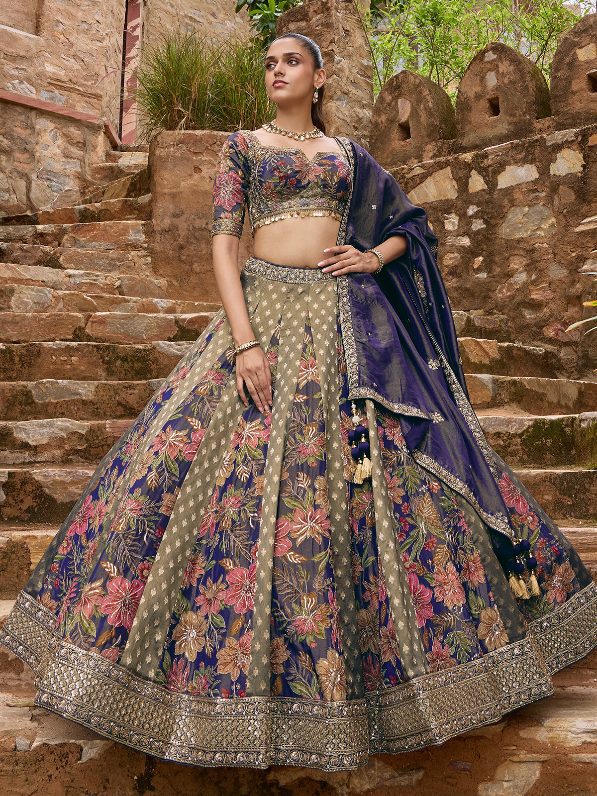 Blue silk lehenga choli with floral motifs and embellished dupatta