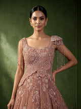 Dusty peach ball gown with floral embellishments and fringe