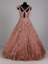 Dusty peach ball gown with floral embellishments and fringe