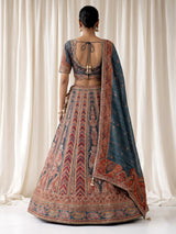 Teal blue lehenga choli with rust paisley detailing