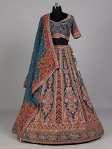 Teal blue lehenga choli with rust paisley detailing