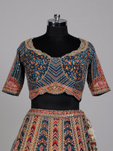Teal blue lehenga choli with rust paisley detailing