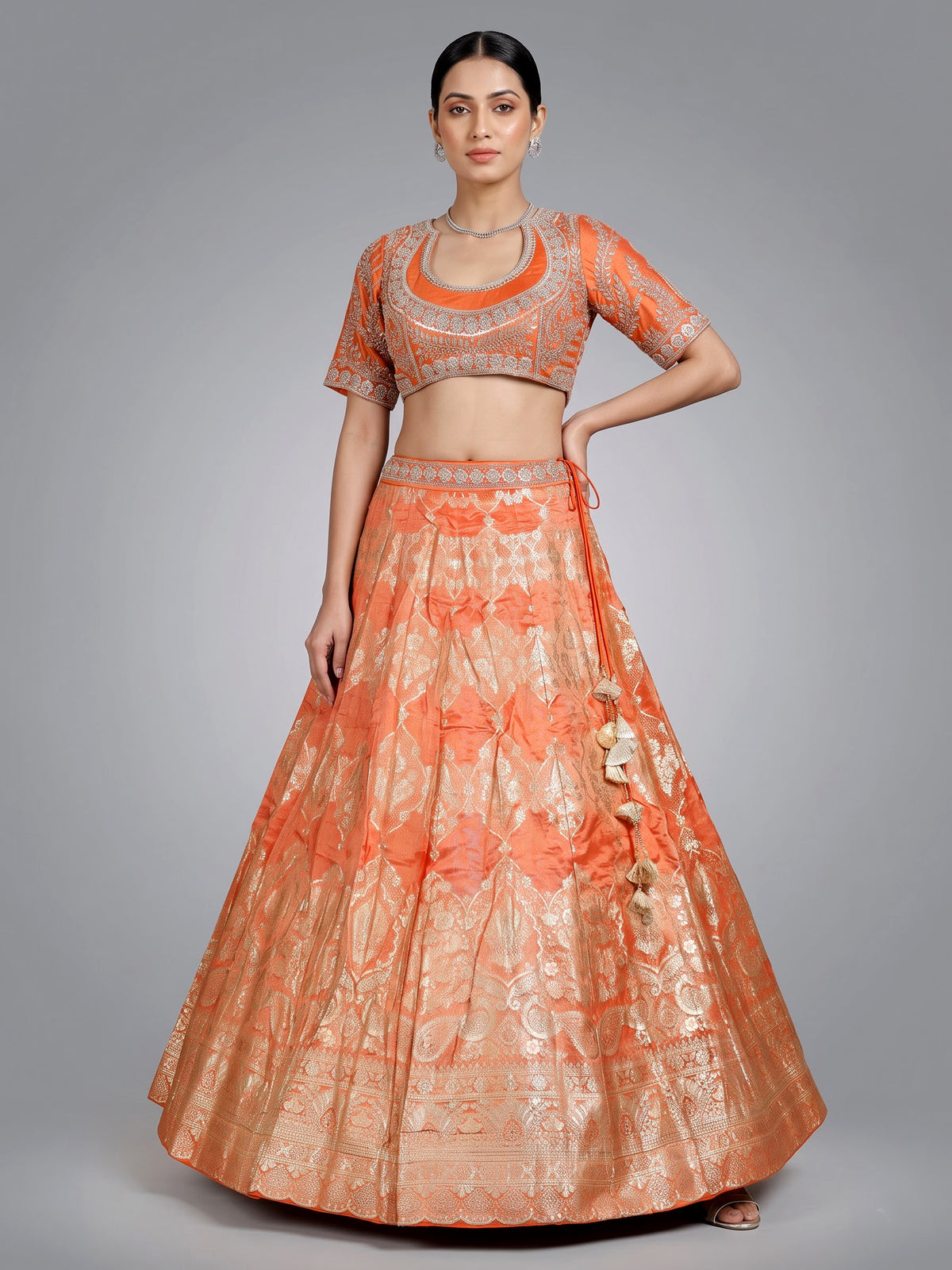 Rust orange banarasi silk lehenga choli with embellished dupatta