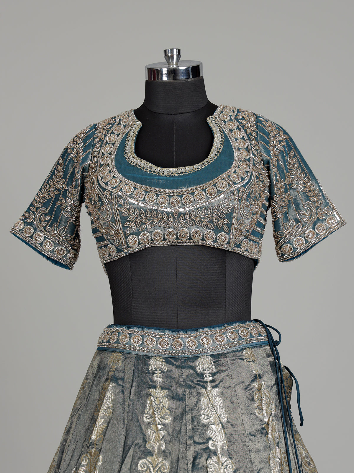 Teal blue banarasi silk lehenga choli with embellished dupatta