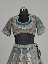 Teal blue banarasi silk lehenga choli with embellished dupatta