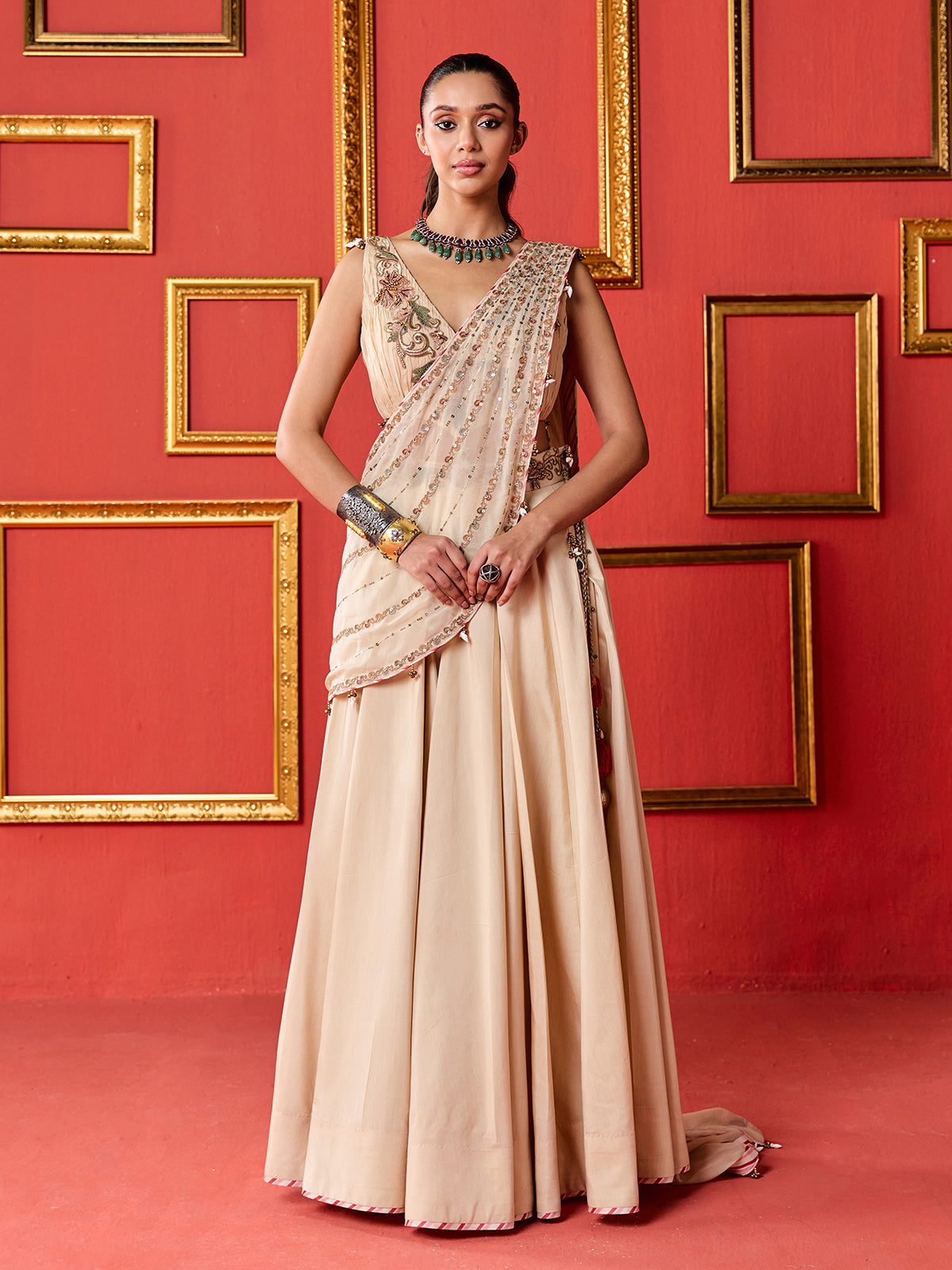 Beige silk designer wedding lehenga choli with tassel accents dupatta