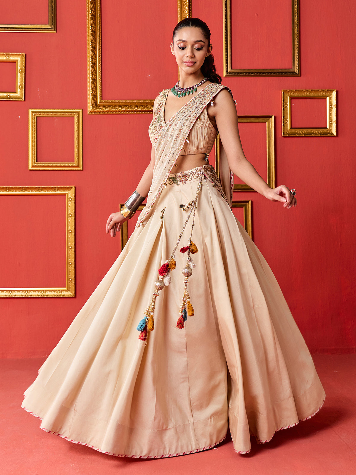 Beige silk designer wedding lehenga choli with tassel accents dupatta