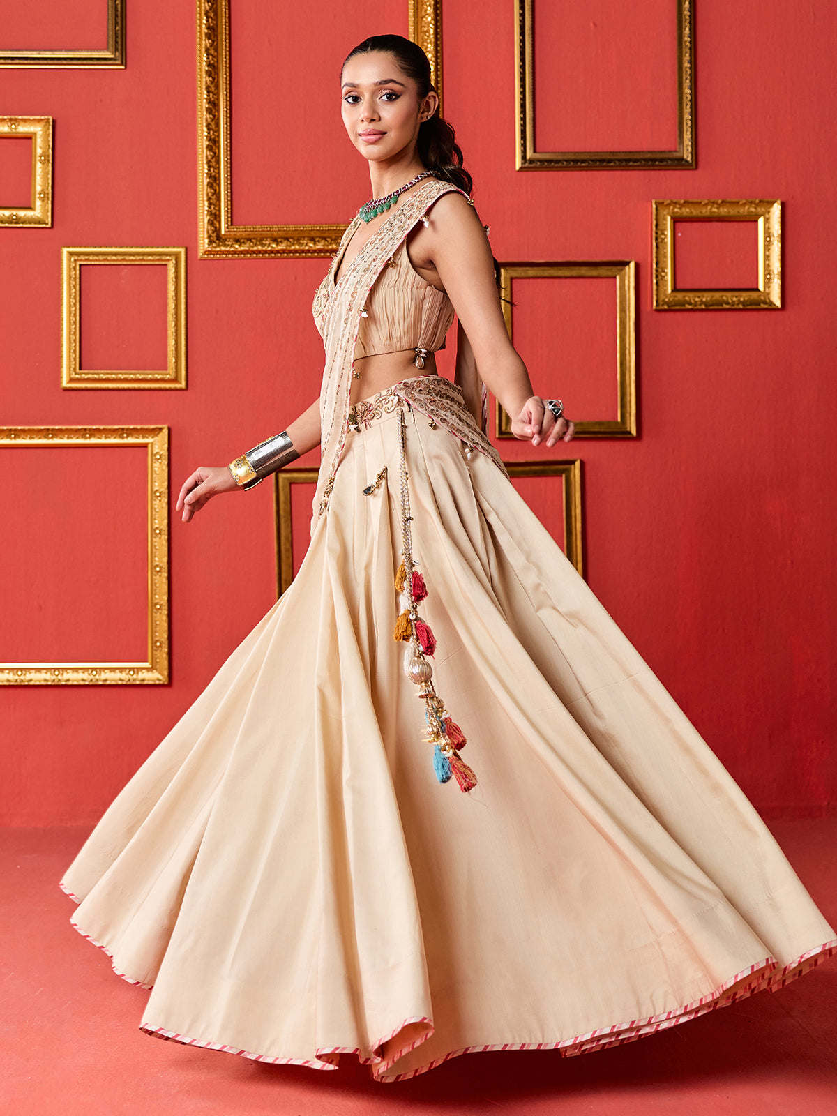 Beige silk designer wedding lehenga choli with tassel accents dupatta