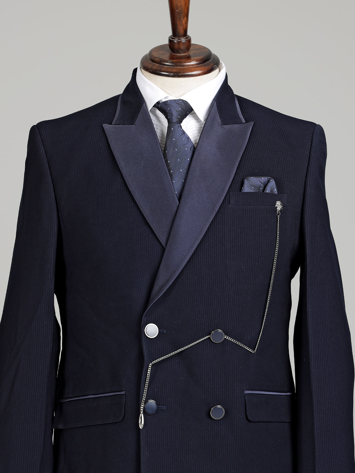 Midnight navy double-breasted tuxedo suit with metallic brooch
