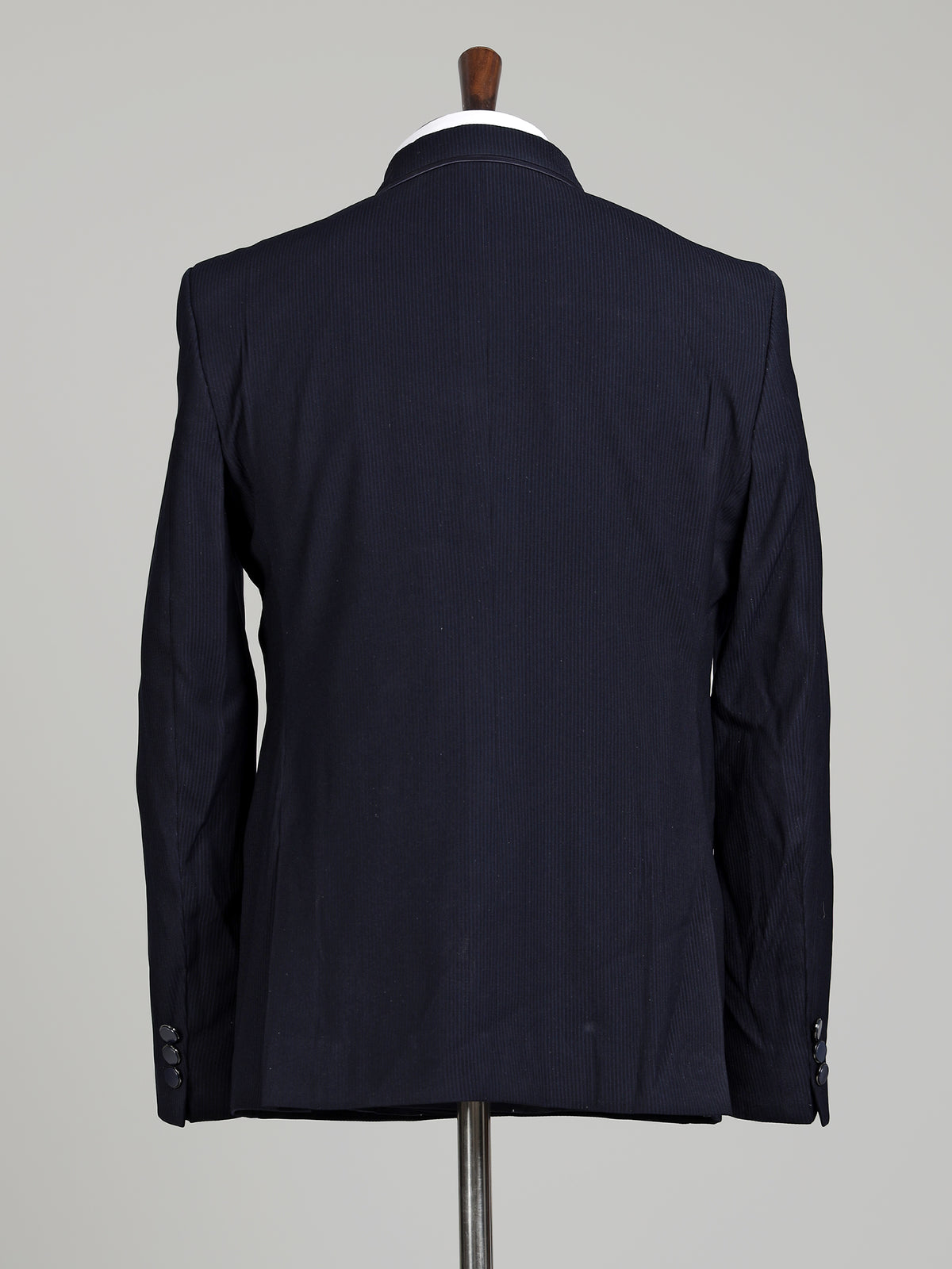 Midnight navy double-breasted tuxedo suit with metallic brooch