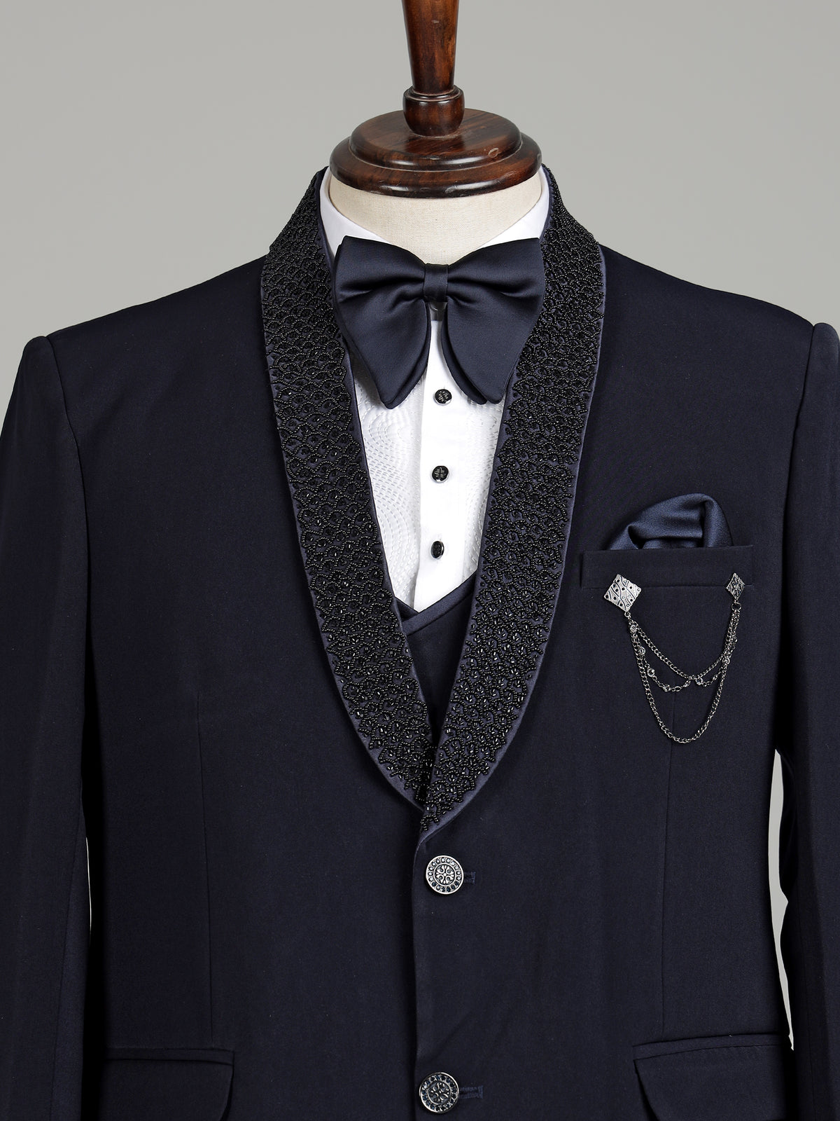 Midnight navy three-piece tuxedo suit with embellished shawl lapel