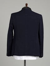 Midnight navy three-piece tuxedo suit with embellished shawl lapel