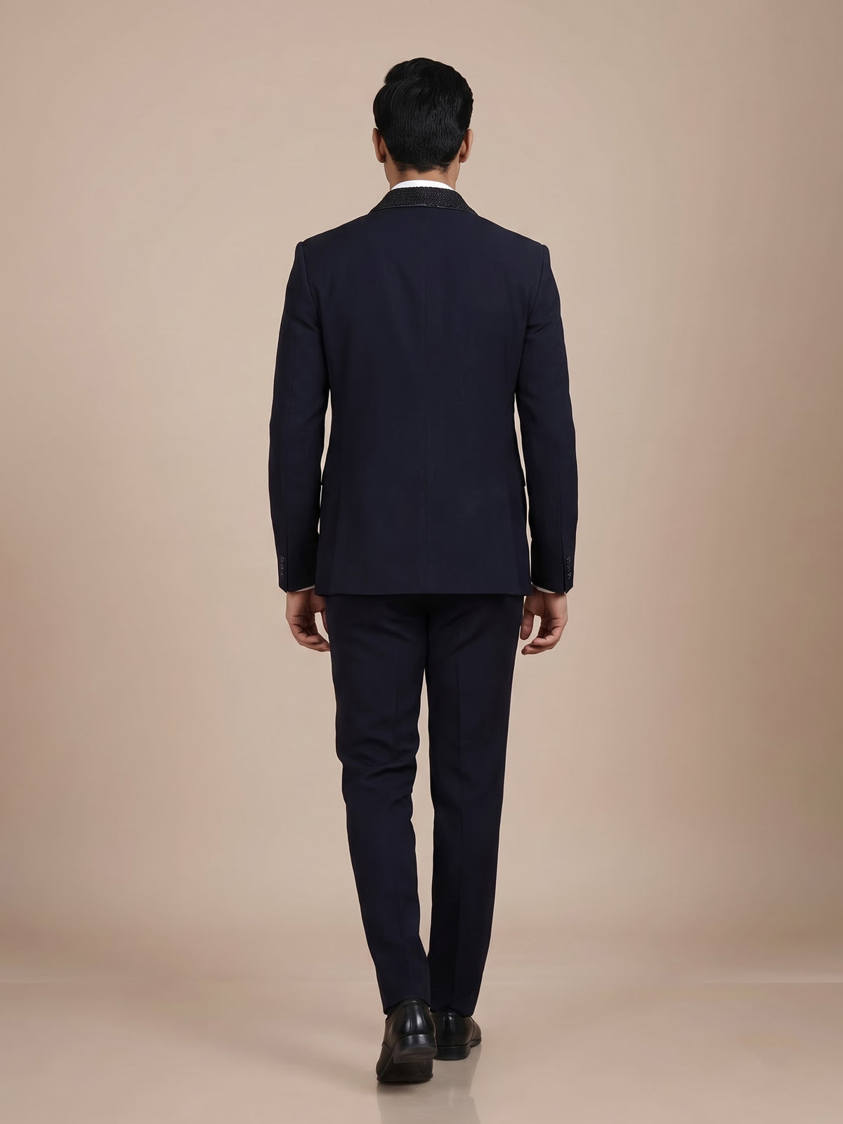 Midnight navy three-piece tuxedo suit with embellished shawl lapel