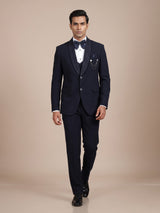 Midnight navy three-piece tuxedo suit with embellished shawl lapel