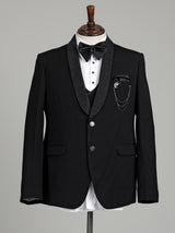 Jet black three-piece tuxedo suit with crystal brooch and cutdana