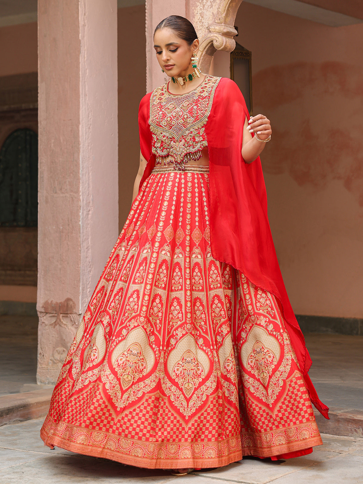Red traditional printed lehenga choli with heavy work cape jacket