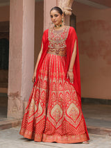 Red traditional printed lehenga choli with heavy work cape jacket