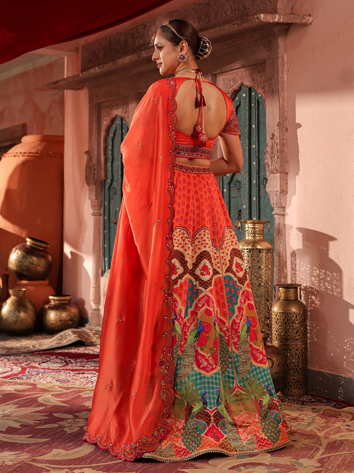 Red traditional print lehenga choli with elegant embellished dupatta