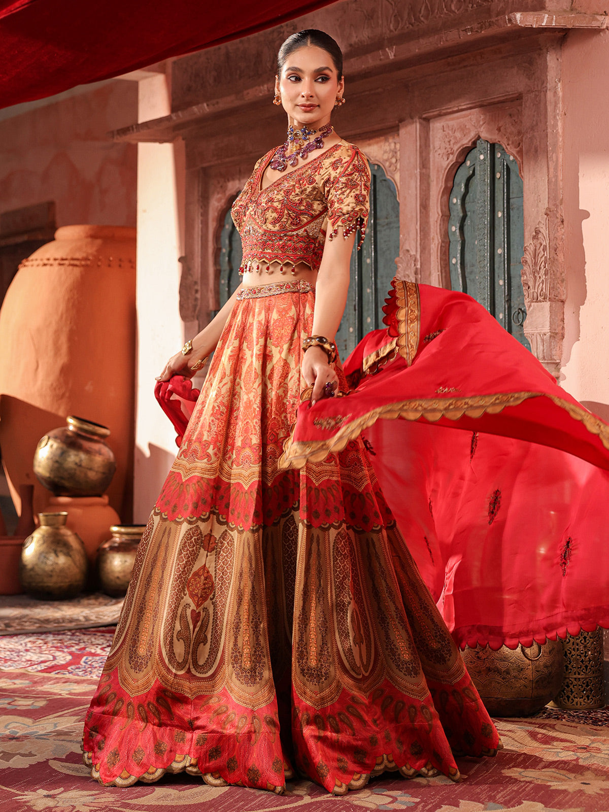Red traditional printed lehenga choli with intricate zardosi details